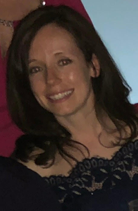 a photo of a woman named Kaitlin smiling