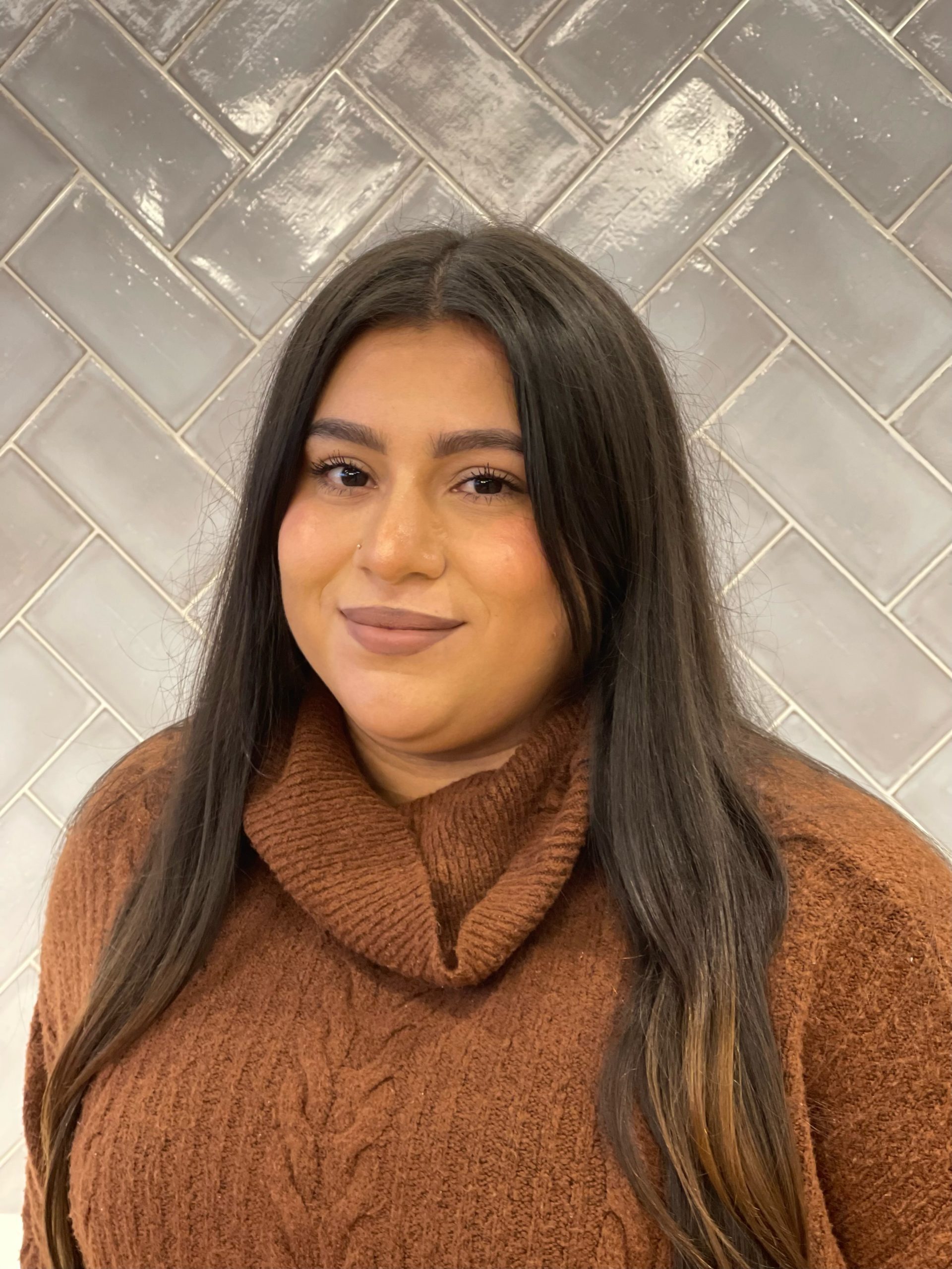 a woman smiling for a portrait photo