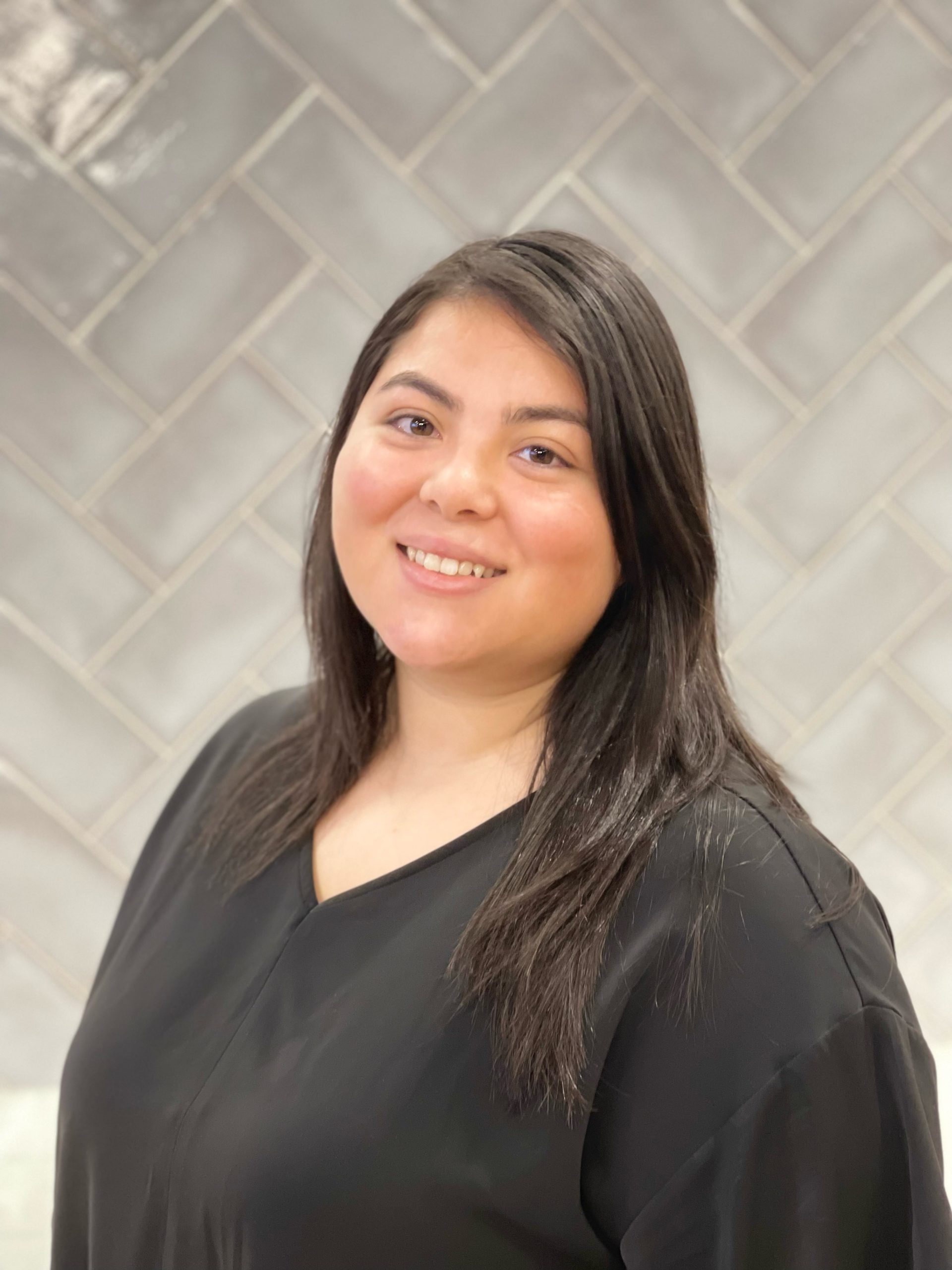 a woman smiling for a portrait photo