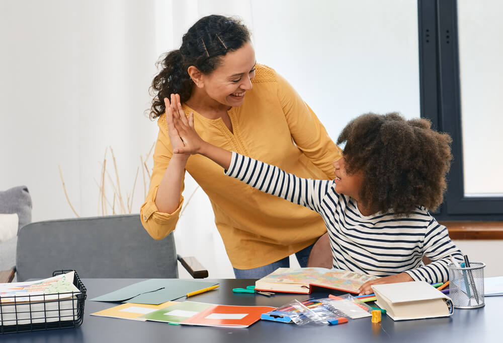 woman high fiving a child