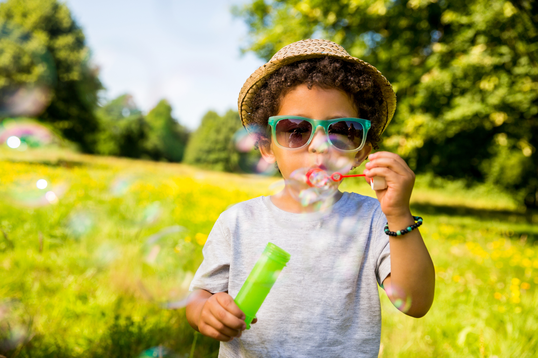 Male child blowing bubbles
